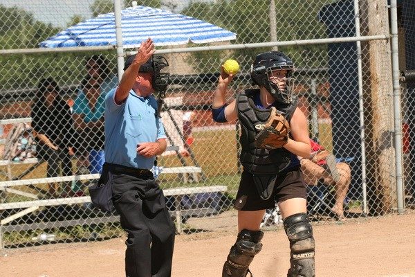 Softball umpire at the plate